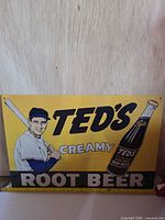 Front of tin sign showing graphics and text