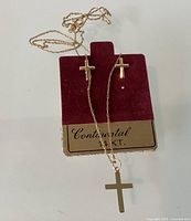 Necklace with cross pendant and cross earrings on Continental 14KT card