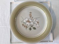 Top view of one Country Day plate showing floral design and green rim