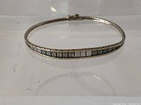 Full view of sterling silver bracelet showing coloured inlay and rope edge