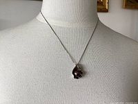 Necklace on mannequin showing overall look and length