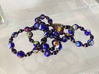 Necklace coiled showing beads and spacers