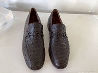 Front view of brown ostrich loafers
