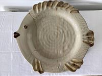 Top view of cream and tan ceramic fish platter