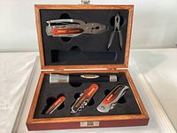 open wood box showing all six tools in foam cutouts
