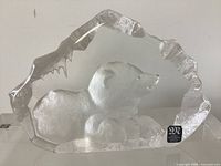 Front view of polar bear cub crystal sculpture showing form and label