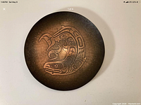 Top view of copper bowl showing etched salmon design