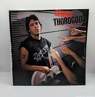 Front cover showing album art and title