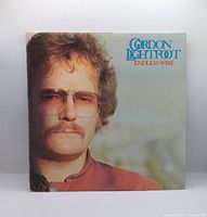 Front album jacket with artist portrait and title