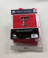 Retail-packaged Texas Tech polyester flag front view