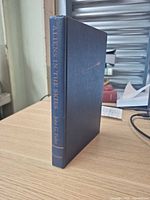 Spine view showing title, author and publisher on cloth binding