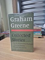 Front view of hardcover book with dust jacket showing title and author