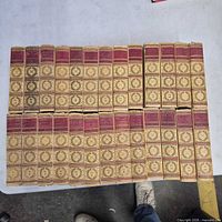 All 25 volumes laid out spine up showing uniform bindings and numbering