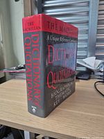 Front spine and cover of hardback showing title and publisher