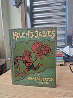 Front cover of green illustrated cloth hardcover book