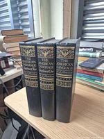 Spine view of three volumes showing titles and supplements