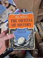 Front cover of The Outline of History Volume 3 showing title, author and dust jacket artwork