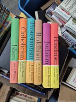 Spines of all six Braziller series books showing titles and colours