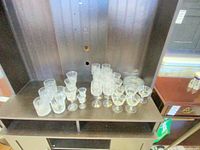 Full assortment of crystal glasses on shelf