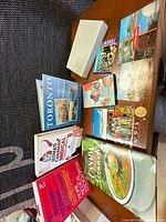 Group shot showing books, postcards and pins