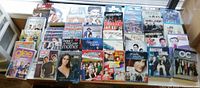 Wide shot of all DVD box sets laid out, showing quantity and titles