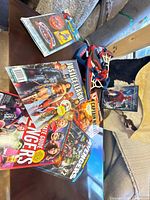 Group view of magazines, Spider-Man toy with figure, DVD