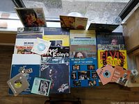 Top-down view of all LPs and singles spread on table