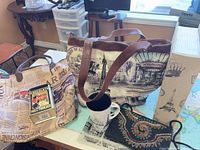 Overview of all five items: two totes, mug, beaded clutch, Eiffel Tower tin