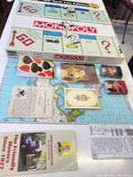 Box and opened New York City Edition Monopoly board with cards, rulebook and dice visible