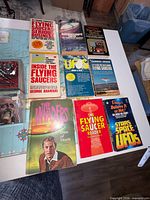 Group shot of books, card packs and plastic case on tabletop