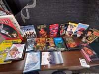 Full view showing assortment of VHS tapes on table