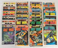 Front covers of all 24 bagged Batman comics arranged in rows