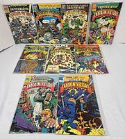 Front covers of nine Captain Victory comic books laid out
