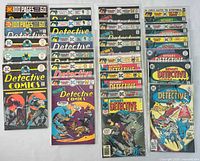All 22 Detective Comics issues, front covers visible, many bagged