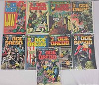 All ten Judge Dredd issues laid out front covers visible