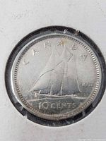 Reverse view showing Bluenose schooner and date 1937