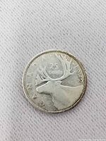 Reverse side showing caribou, date 1942, denomination