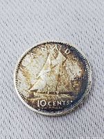 Reverse showing Bluenose schooner and denomination