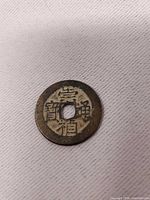 Obverse showing inscription and round form