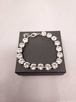 Top view of rhinestone bracelet on gift box