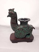 Full view of bronze bird ashtray sculpture on base