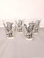 Group of four Colonel Sanders glasses front view