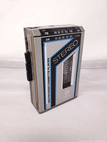 Front view showing branding, tuner scale, and cassette compartment window