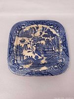 Full view of square blue willow plate front