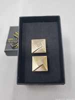 front view of cufflinks in box