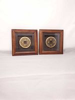 Full view of the two framed coins