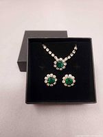 Necklace and earrings displayed in gift box