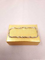 Full view of bracelet displayed on box