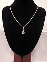 Full view of sterling silver necklace on display bust