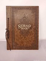 Front view of scrapbook cover showing embossed detailing and title